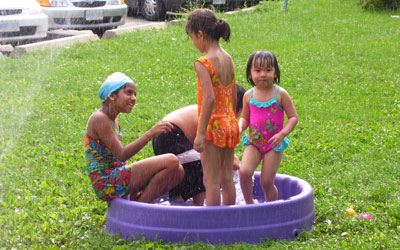 children playing in a kiddie pool
