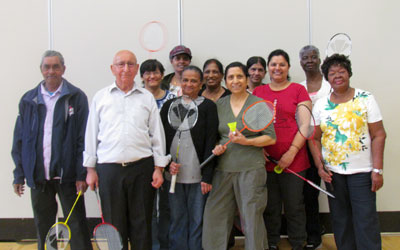 Group of seniors with badminton rackets