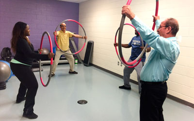Seniors exercising with hula hops